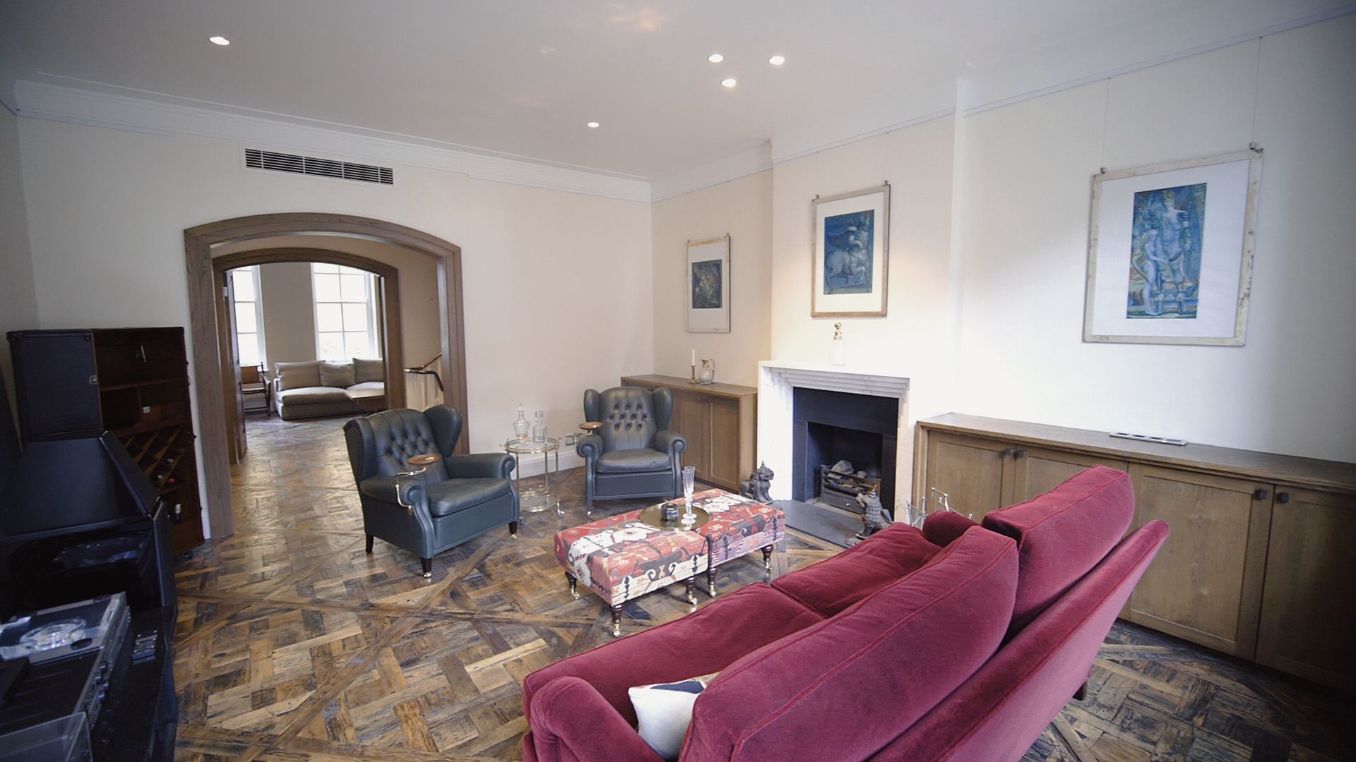 Reception room with reclaimed parquet de Versailles floor, marble fireplace and oak joinery