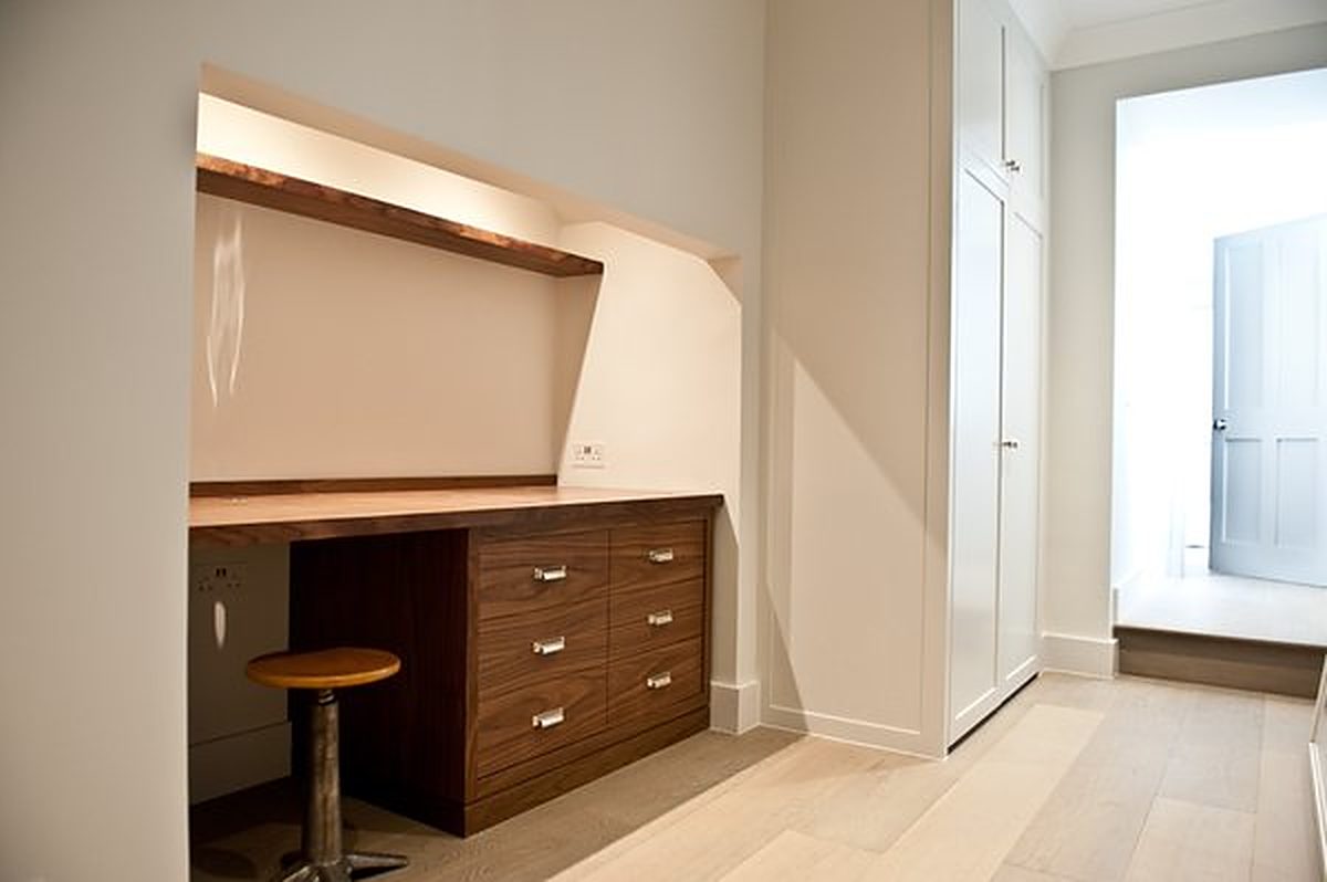 Walnut desk and drawer unit built into an alcove